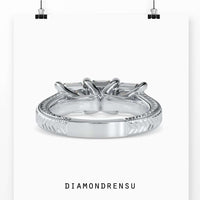 Three stone emerald cut diamond ring in 3 stone trellis ring setting.