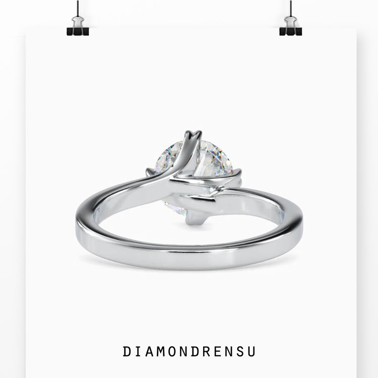 Round diamond solitaire engagement ring with a classic prong setting.