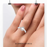 Beautiful emerald three stone ring featuring an 8 prong engagement
ring design.