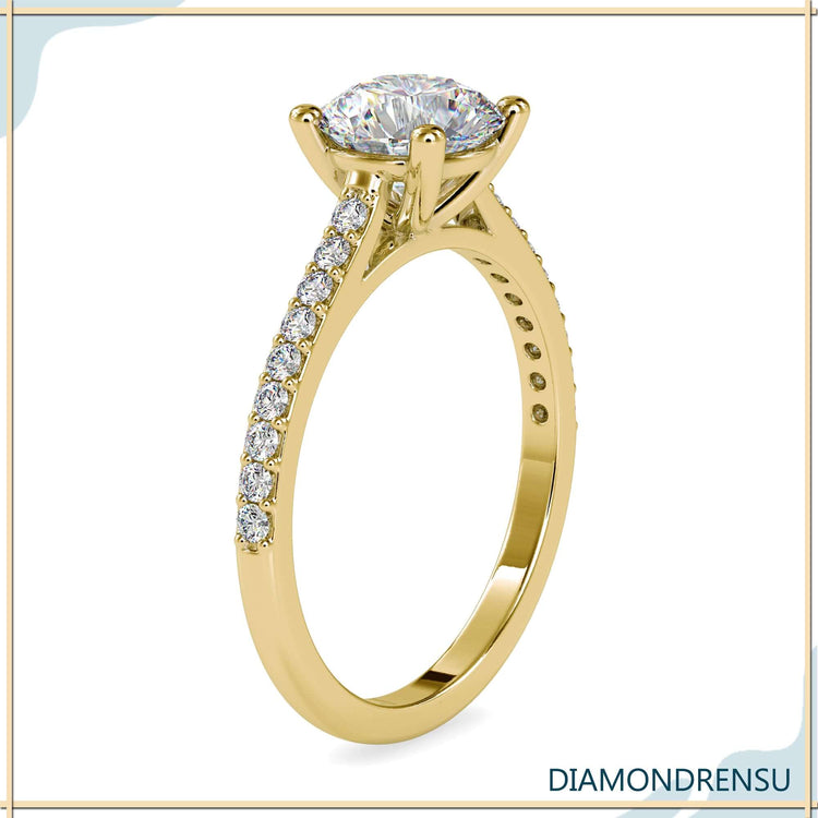 Pave ring setting with a four prong engagement ring design, featuring a round diamond.