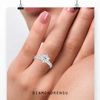 6 prong round engagement ring with a channel set diamond design and IGI certified stone.