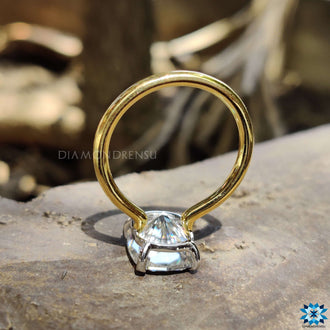 Elegant cushion cut solitaire featuring sparkling brilliance.