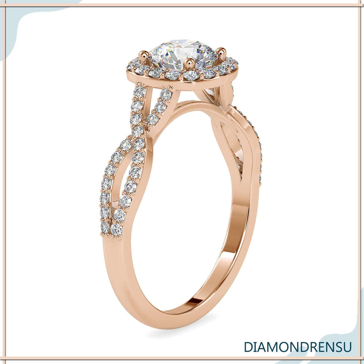 Pave twist ring in a round cut halo engagement design.