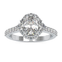 Oval diamond engagement ring with pave setting in white gold