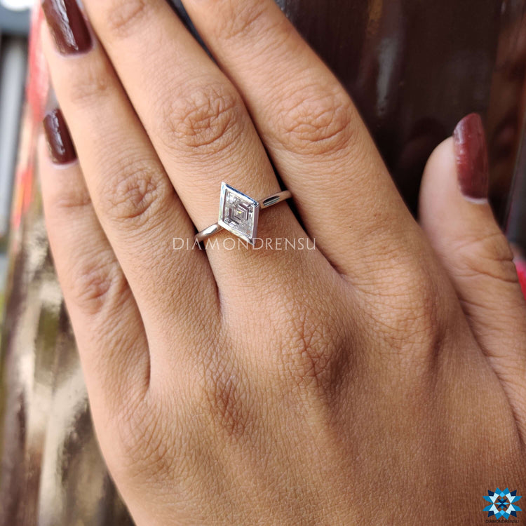 Lozenge shape engagement ring with a modern design.