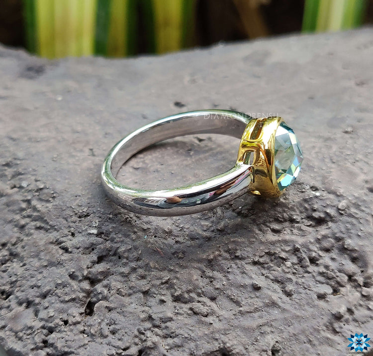 A beautiful bezel setting on a handcrafted engagement ring, emphasizing the gem's clarity and brilliance.