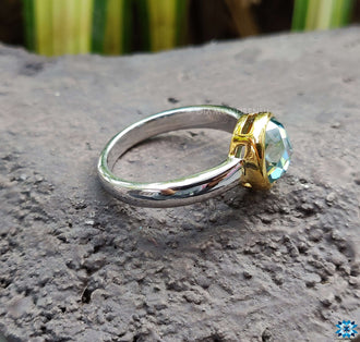 A beautiful bezel setting on a handcrafted engagement ring, emphasizing the gem's clarity and brilliance.