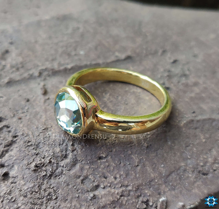 Bezel set round ring crafted with exquisite attention to detail.