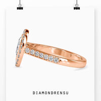 Pear diamond engagement ring in a classic cathedral setting.