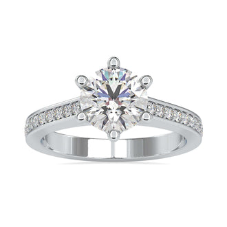 Handmade diamondrensu engagement ring with a six prong setting and pave channel setting.