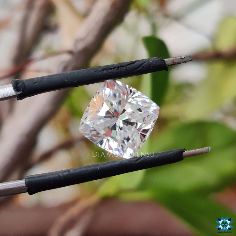 Colorless moissanite sparkling in cushion cut stone.