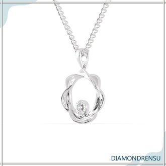 The floating diamond pendant shines with suspended elegance.