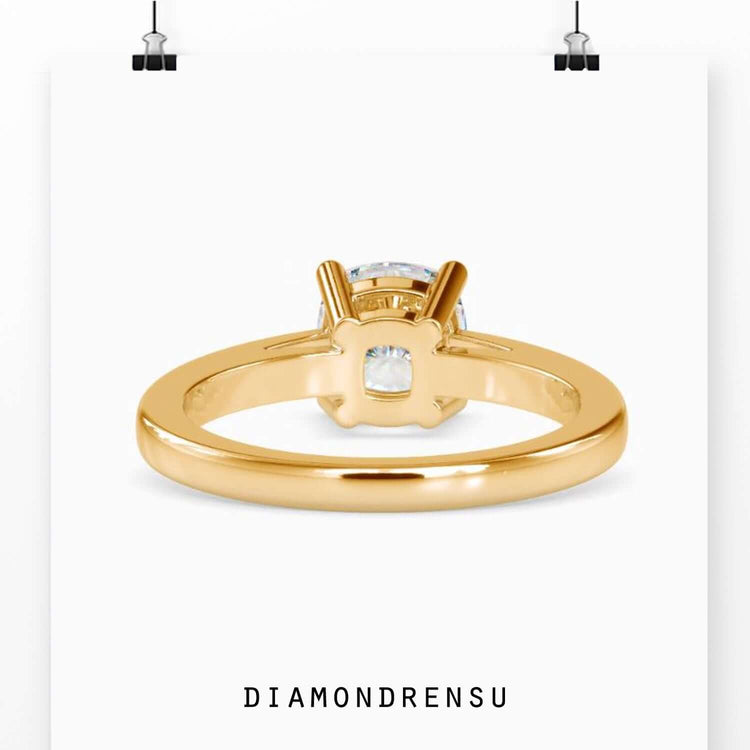 Rose gold, white gold, or yellow gold ring with a cushion cut diamond setting.