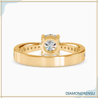 Round brilliant cut diamond ring with a 4 prong round engagement ring setting.