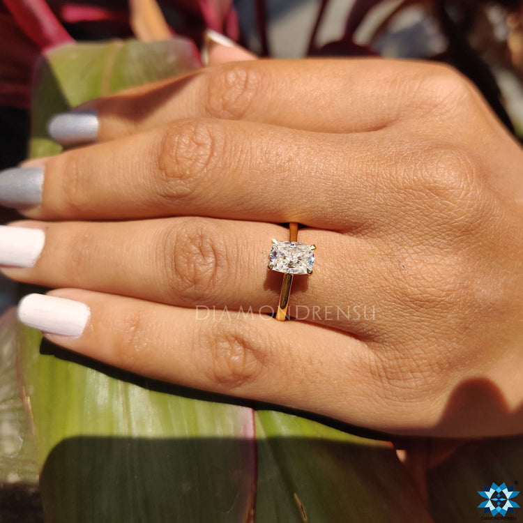 Claw prongs enhancing the beauty of the elongated cushion cut ring.