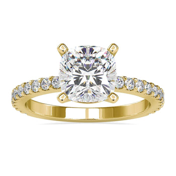 Cushion cut diamond ring with a pave diamond band and basket setting.