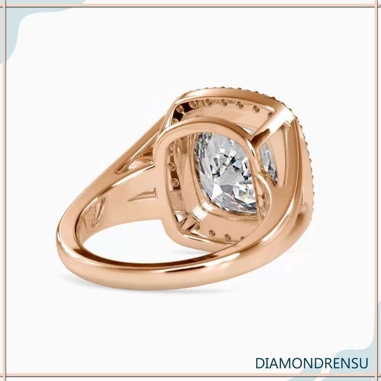 Halo diamond engagement ring featuring a 3 carat cushion cut diamond and pave accents.