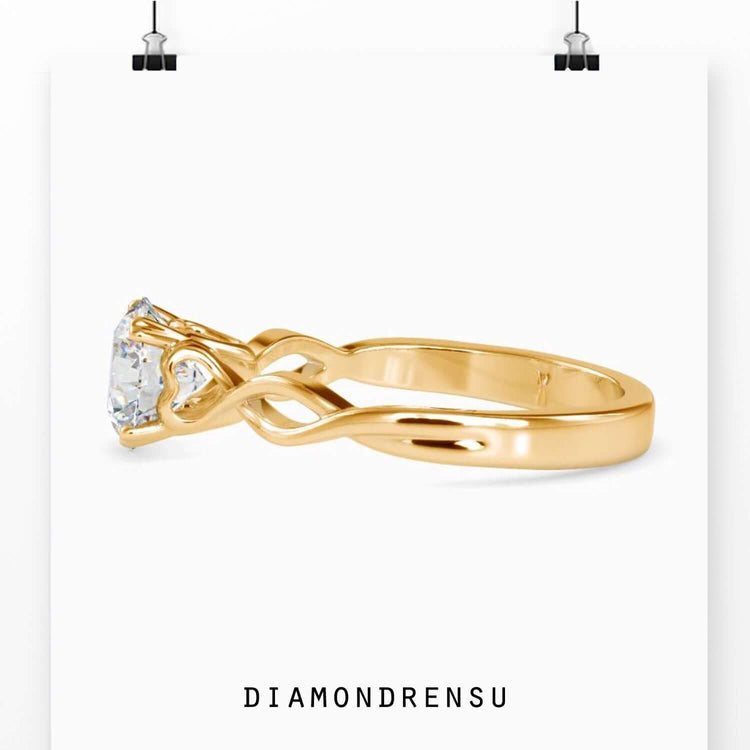 4 prong diamond ring with a brilliant round cut stone.