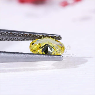 Loose lab grown oval yellow diamond certified IGI.