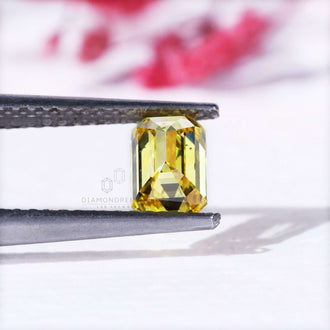 Loose emerald cut yellow diamond lab grown.