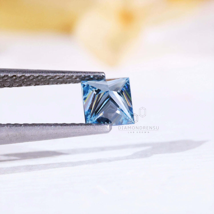 Lab grown diamonds loose stones include 0.54 carat princess diamond in blue.