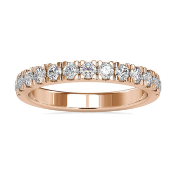 Diamond wedding band with round cut diamonds in a white gold setting.