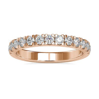 Diamond wedding band with round cut diamonds in a white gold setting.