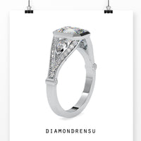 Handmade emerald cut diamond ring with bezel setting in yellow gold