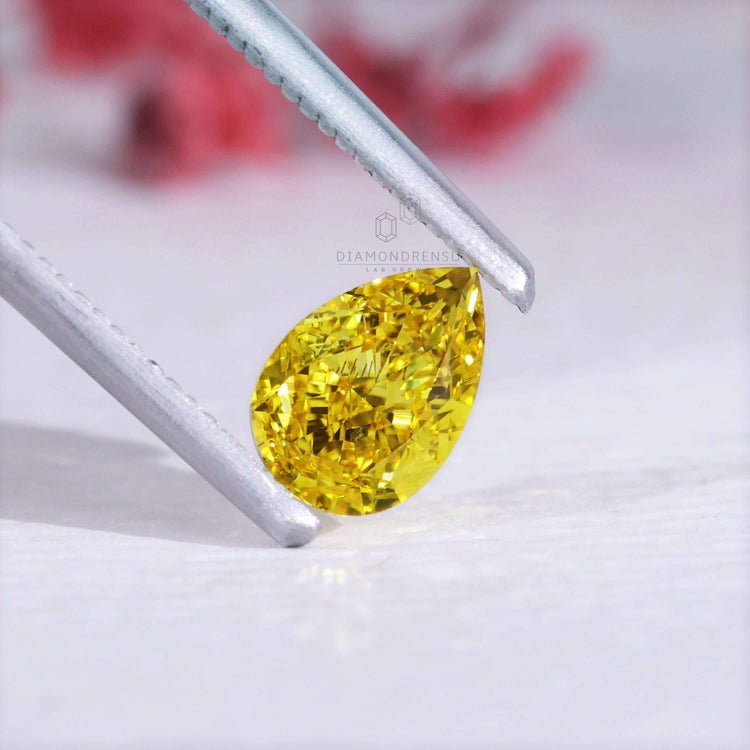 Lab grown diamond in pear cut yellow form comes IGI certified and ready to use.