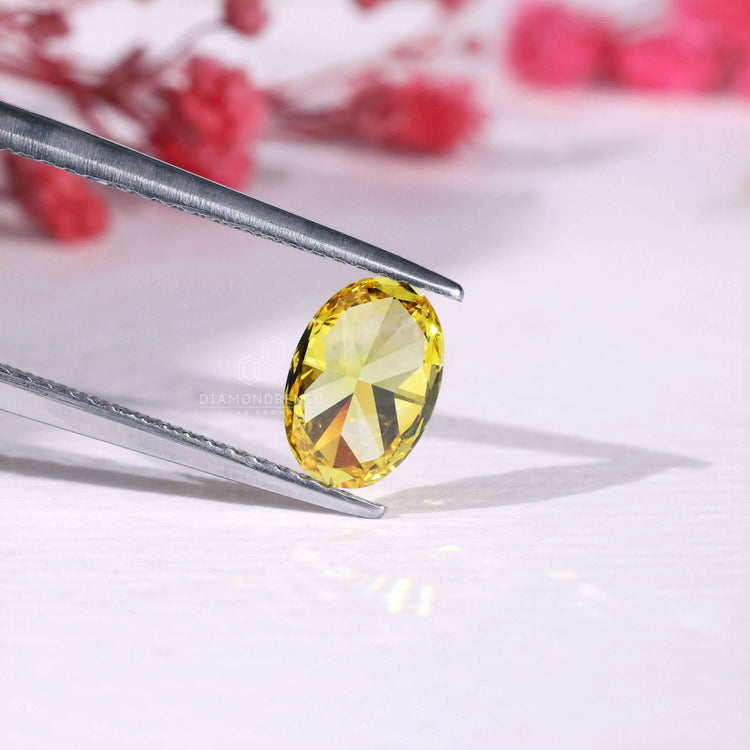 Buy loose oval yellow diamond IGI certified.