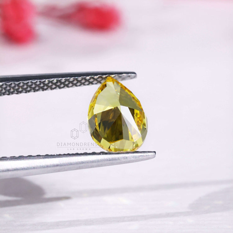 Lab grown diamond pear cut yellow diamond.