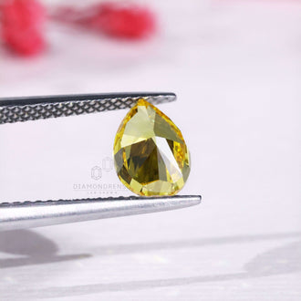 Lab grown diamond pear cut yellow diamond.