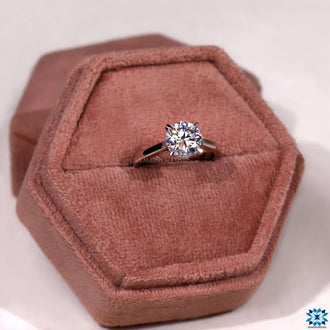 4 prong solitaire engagement ring offering secure setting and timeless beauty.