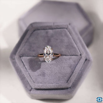 Moisanite engagement ring with a classic solitaire setting.