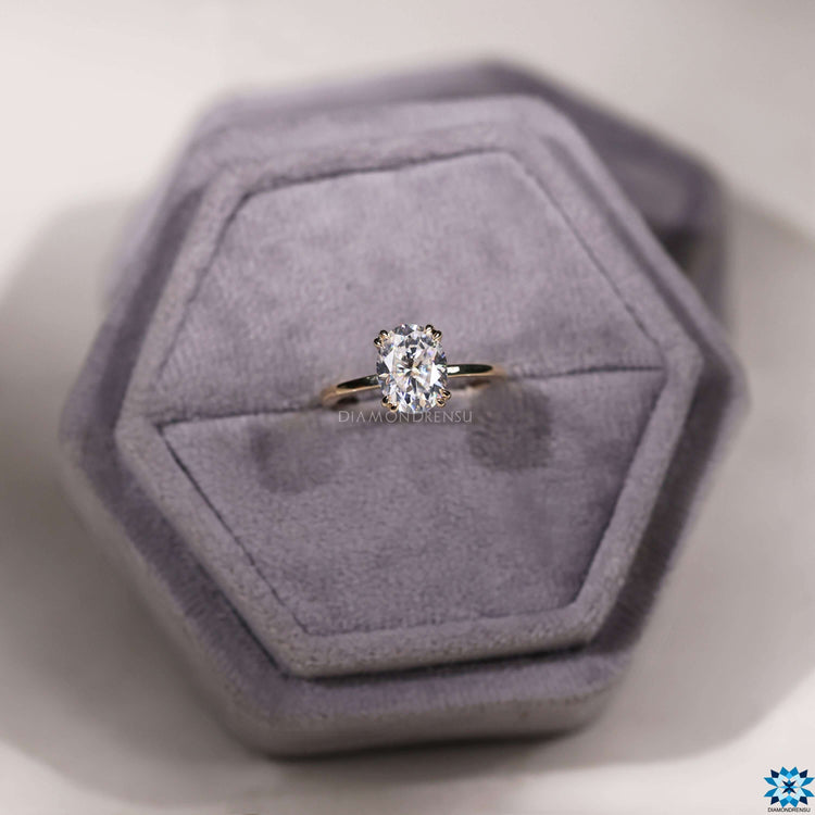 Oval moissanite ring set in classic yellow gold