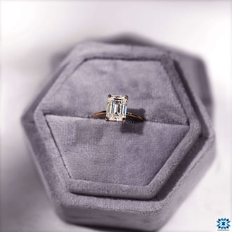 Sparkling moissanite emerald cut engagement ring with a sophisticated solitaire style.
