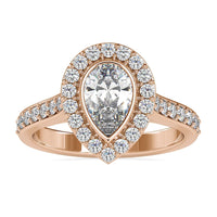Pear engagement ring with a stunning halo and pave accents.