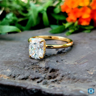 An elongated cushion moissanite ring crafted in yellow gold, perfect for a special occasion.