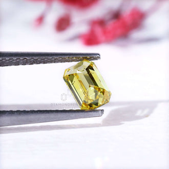 0.70 carat loose yellow emerald cut diamond.