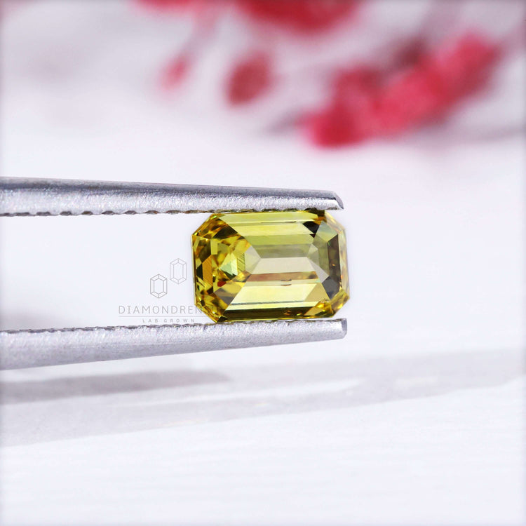 Loose lab grown yellow diamond emerald cut stone.