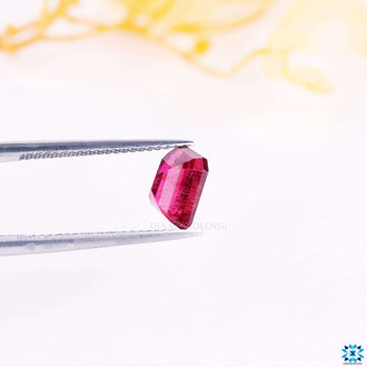 Tourmaline gemstone with vibrant pink hue.