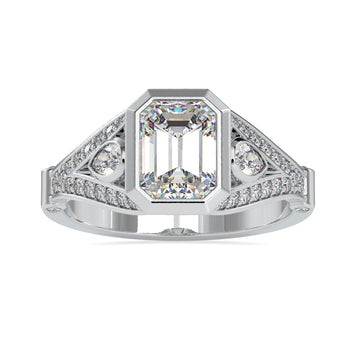 Emerald shaped engagement ring with split shank design in white gold