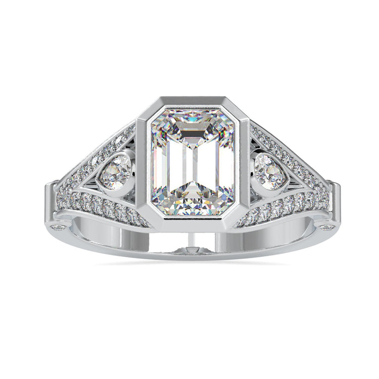 Emerald shaped engagement ring with split shank design in white gold