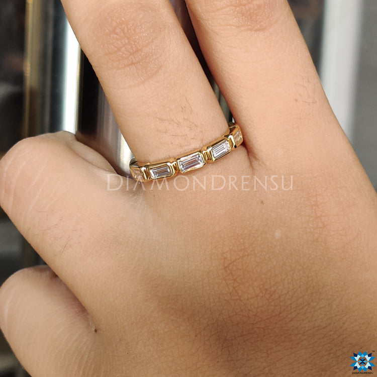 Moissanite wedding band featuring a classic and chic style.