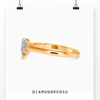 Pear shaped ring in a gold setting, perfect as a solitaire engagement ring.
