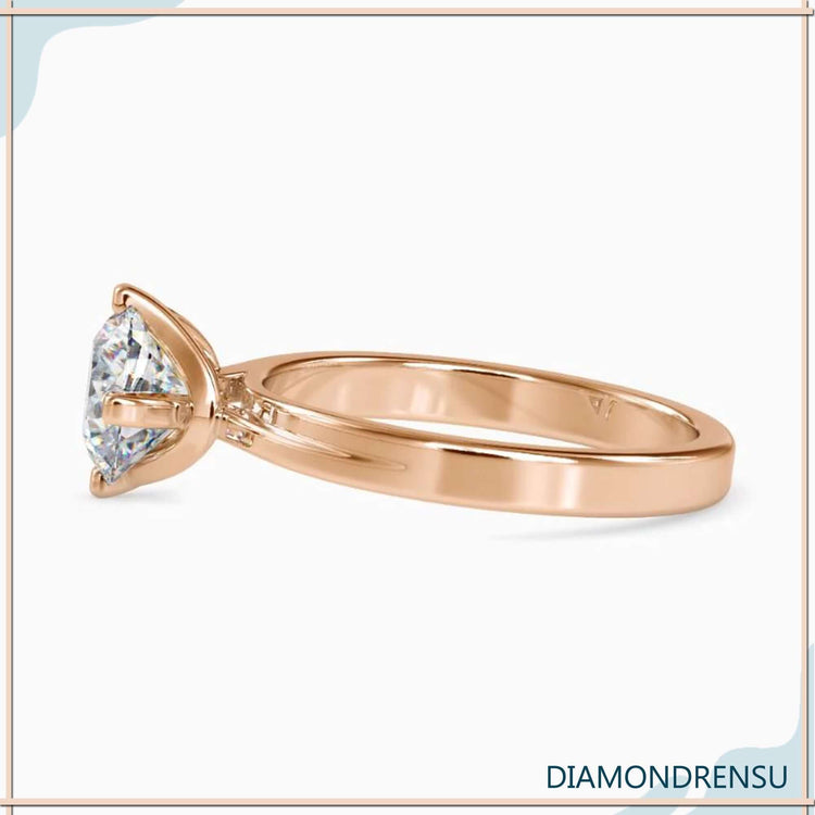 Round solitaire engagement ring with a timeless, elegant design.