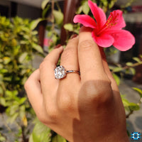 Cathedral ring setting with sparkling moissanite stone.