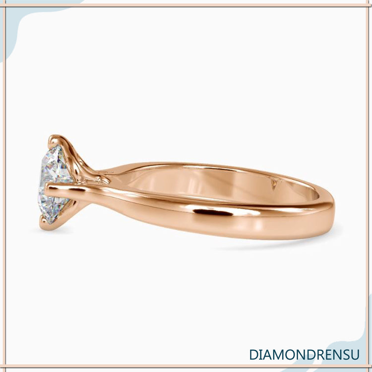 2 carat round cut diamond ring in an elegant pave setting.