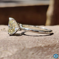 Radiant cut wedding ring with intricate handmade detailing.