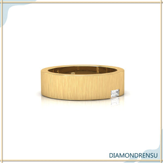 Yellow gold wedding band with brushed finish and handmade details.